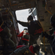 Illustration for article titled Check Out These Shots Of A C-17 Dropping Pararescuemen Over The Navy's Arctic Outpost